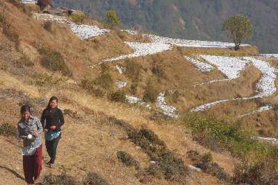 Snow-covered Himalayan terrace fields near Basantapur Bazar, Nepal 