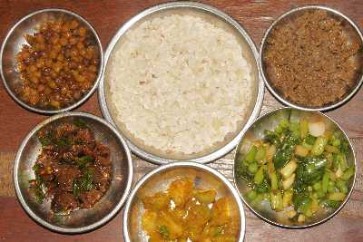Newari Food in Kathmandu: Chana (chickpea), Choila (marinated buffalo), Alu (potato), Lasun Motar Kosa (raw garlic green), Kochila (fried ground buffalo) with beaten rice