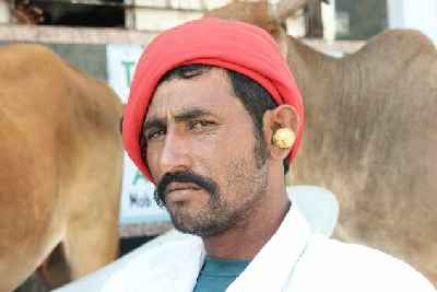 Resident of Dwarka with earrings, Dvarka, Gujarat, India