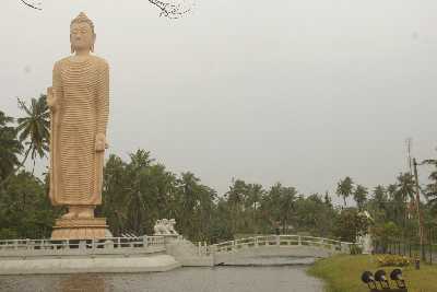 Modern monumental Buddha Statue at Tsunami Honganji Viharaya in Telwatta, North of Galle, South-Western Sri Lanka