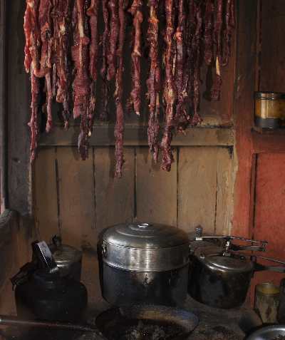 Sukuti (dried water buffalo) drying over an oven in Hile, Nepal