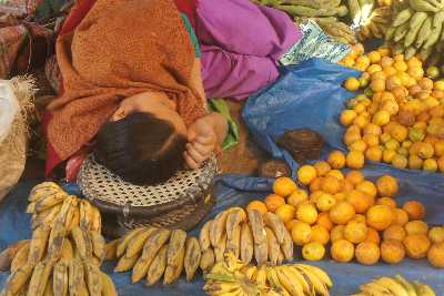 Sleeping market woman at Ima Keithel (Mother Market) in Imphal (Manipur, North Eastern India)