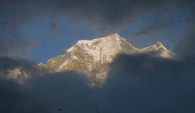 Nilgiri peak seen through a window in the clouds in Lete (Mustang, Nepal)
