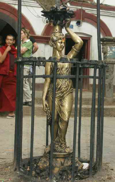 Classical Greek famale statue in front of Seto Machendranath Mandir, Kathmandu, Nepal