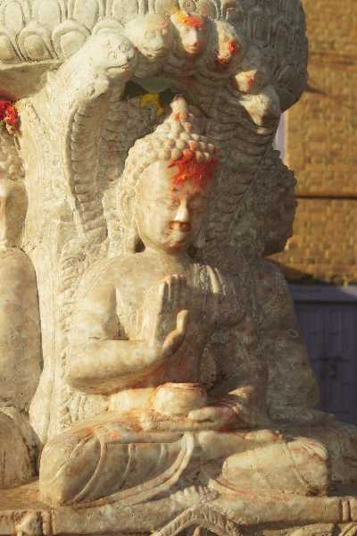 Buddha figurine carved into a marble chaitya (Buddhist stupa) in Kirtipur (Kathmandu Valley, Nepal)