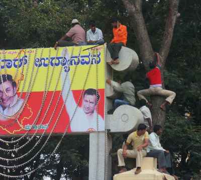 Spectators climbing various structures to see Dasara (Dussera) festival in Mysore, Karnataka, India