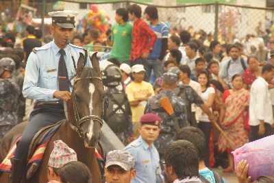 Mounted police managing the crowds during the Rato Machendranath Jatra festival in Patan, Kathmandu Valley, Nepal