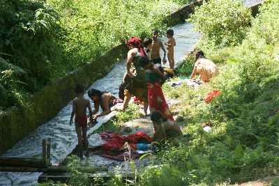 Pokhara/Nepal: Villagers washing their clothes in a stream