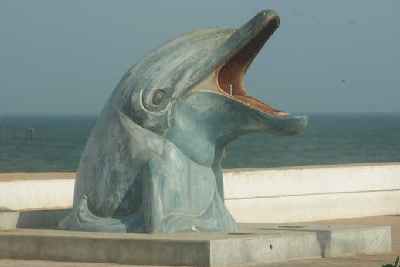 Dolphin-shaped wastebasket at beach promenade in Pondicherry (Puducheri), South India