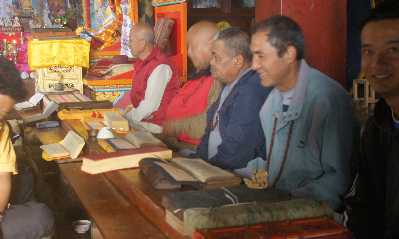 Recitation from the Tibetan Book of Deads during Buddhist Puja temple ceremony in Tarke Gyang, Helambu, Nepal