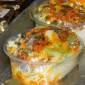 Rasmadhuri, cheese ball in syrup flavoured with saffron and pistacchio, at Sri Rajbandhu sweet shop, Varanasi, Uttar Pradesh, India