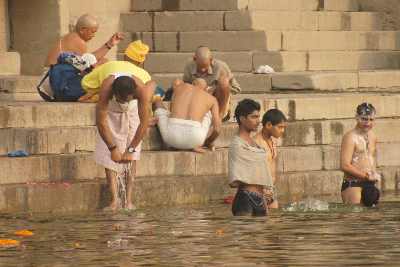 Brahmins taking a morning bath in the holy Ganga river, Varanasi, Uttar Pradesh, India